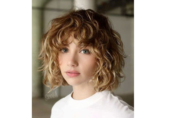 Premium Photo | A closeup stock photo of curly hairstyles for short curly  hair on girls short curly hairstyles